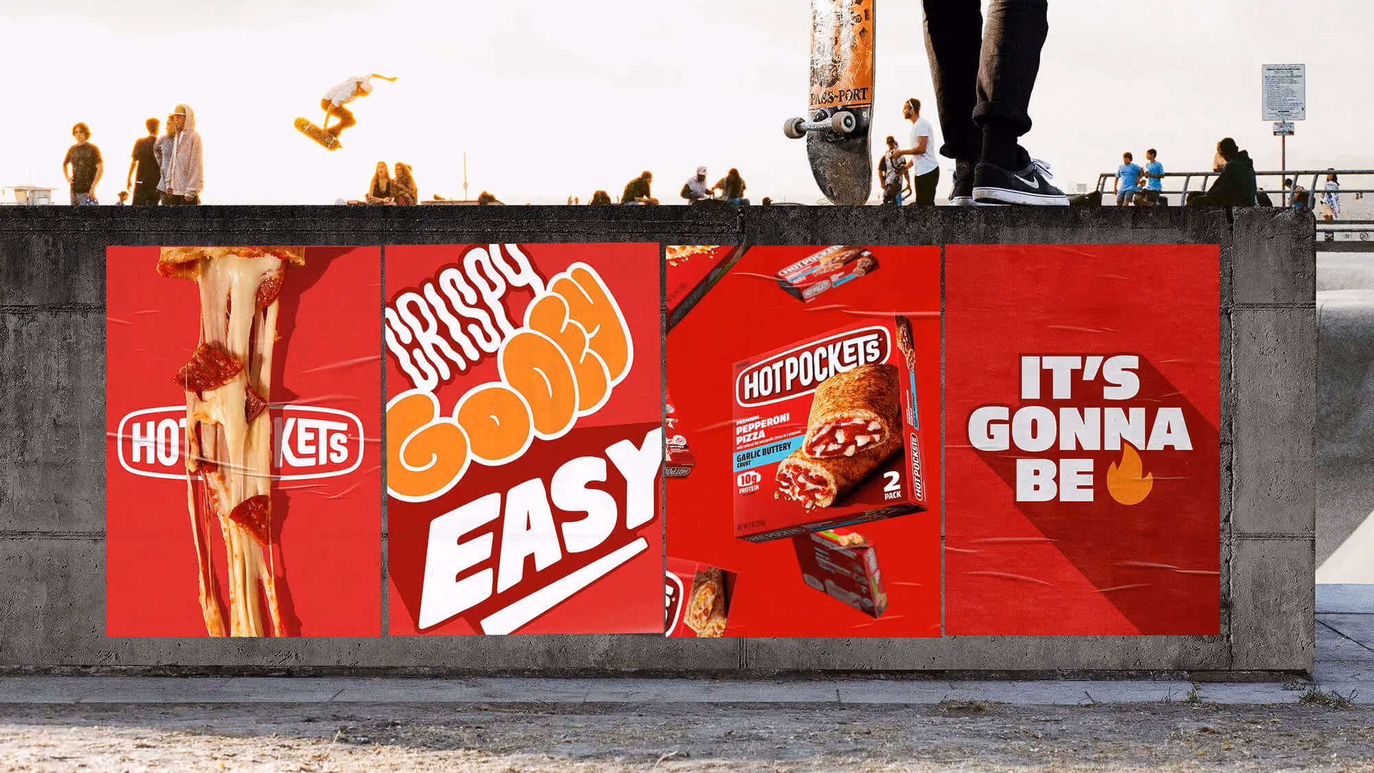 Wheatpaste poster wall at a skatepark with four red Hot Pockets posters including dripping cheese and 'Crispy gooey easy'.