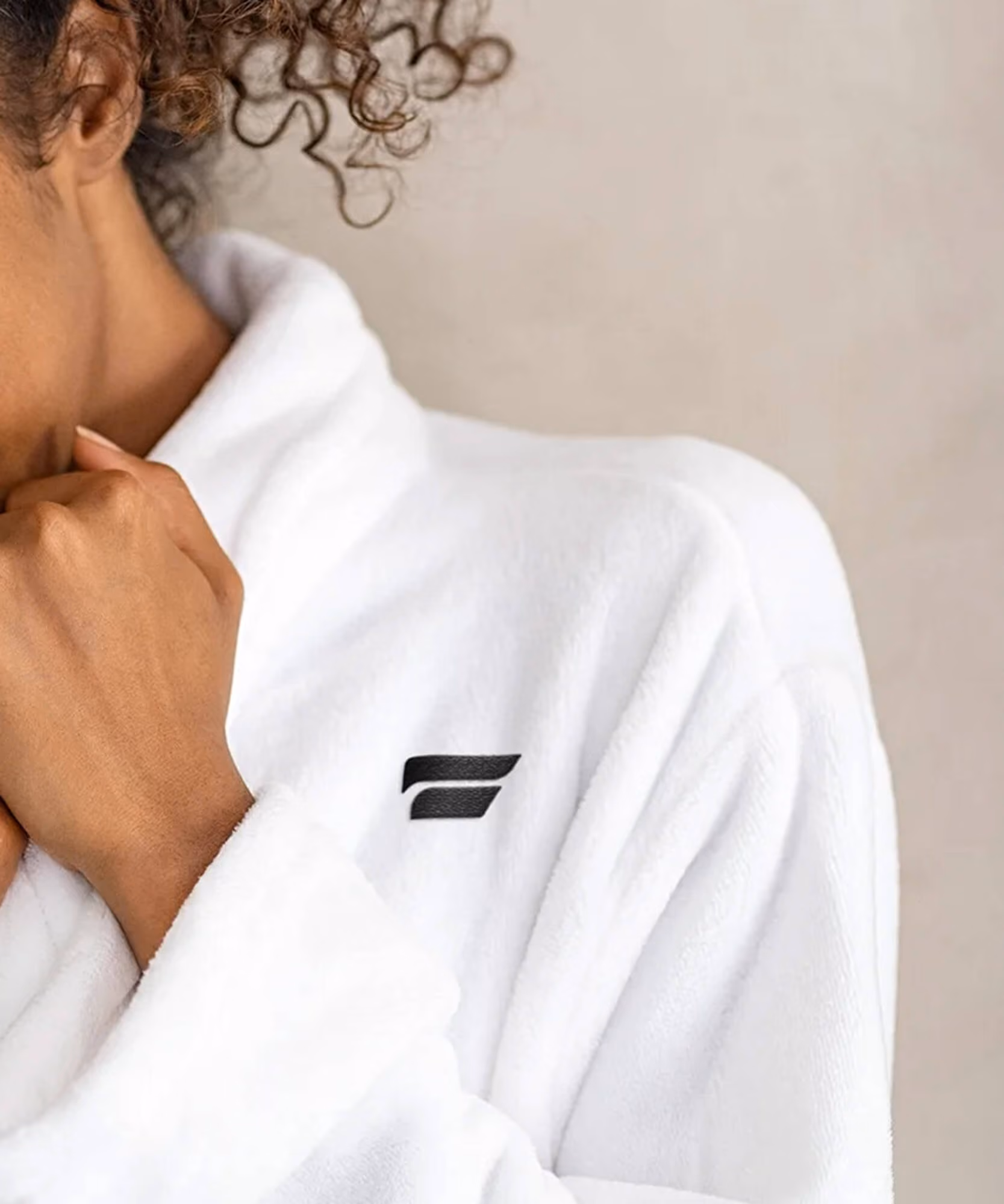Plunge product triptych: white 'Mood Boost' flip-flops, a person in a logo robe, and a folded white logo towel.