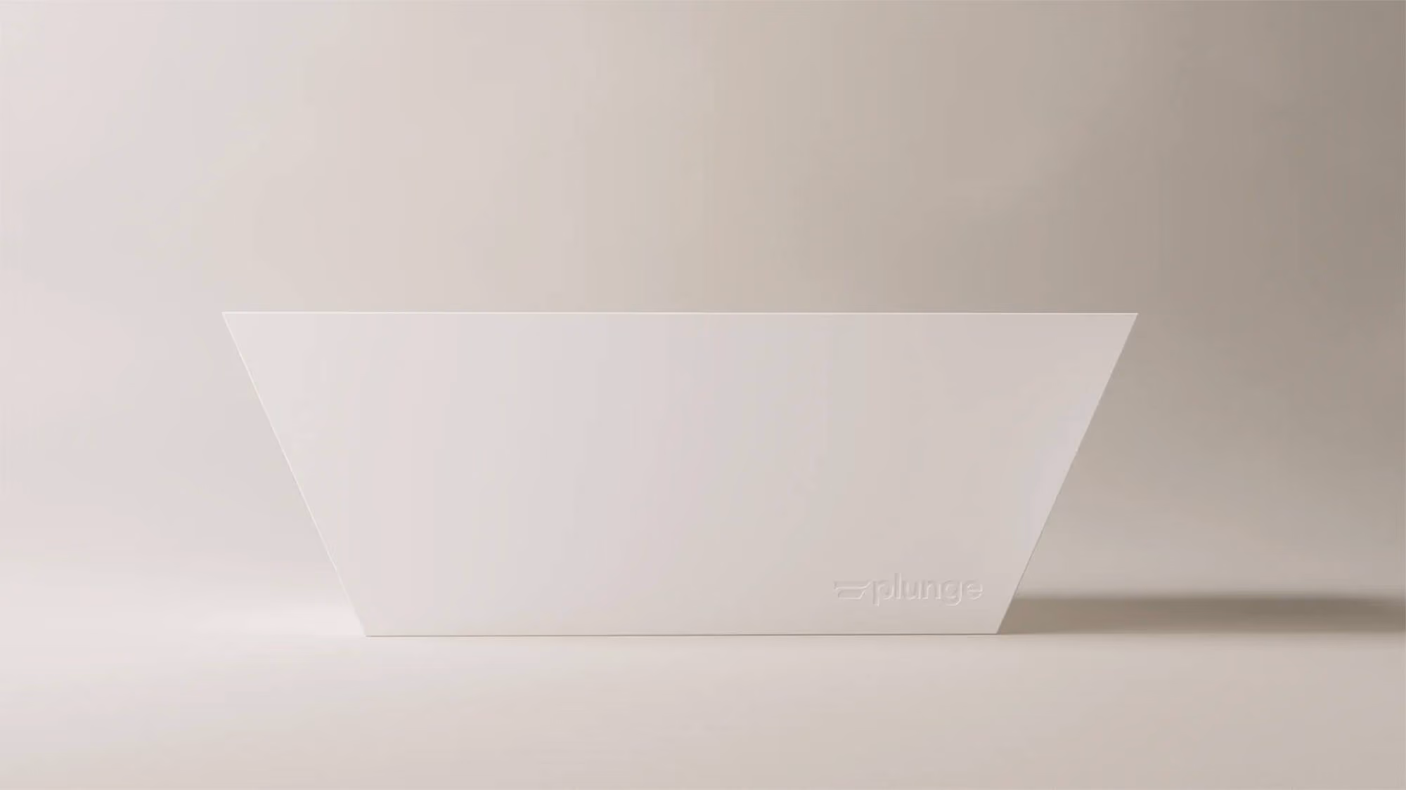 White trapezoidal Plunge cold plunge tub against a beige studio backdrop with embossed wordmark.