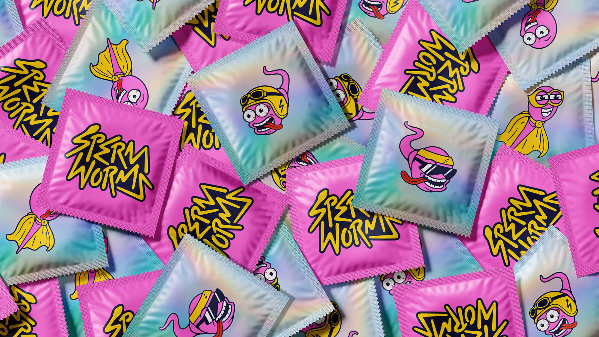 Pile of holographic pink Sperm Worms condom-style foil packets printed with the logo and various worm characters.