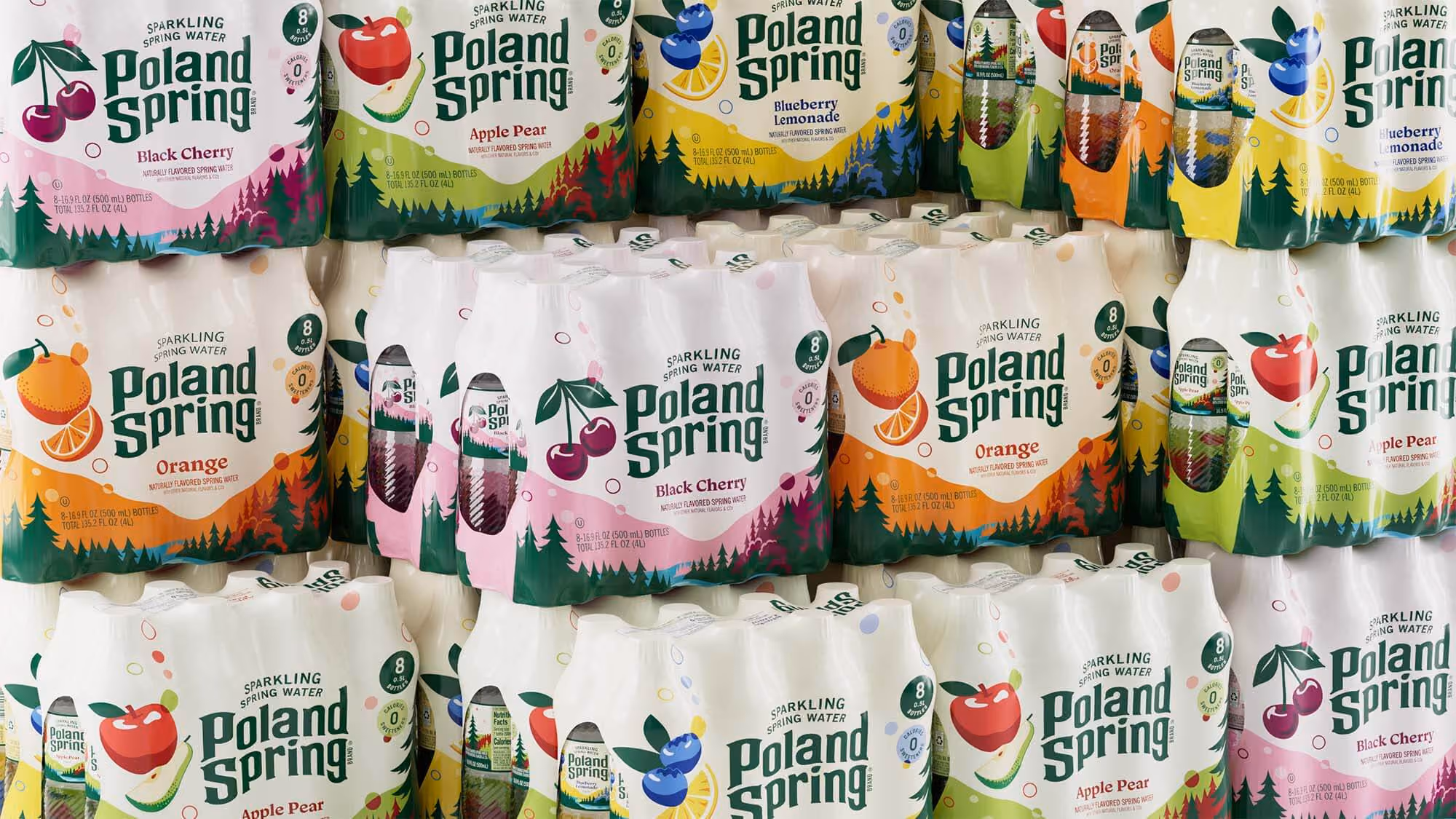 Stacked 8-pack cartons in "Black Cherry", "Apple Pear", "Blueberry Lemonade" and "Orange", each wrapped in illustrated pines