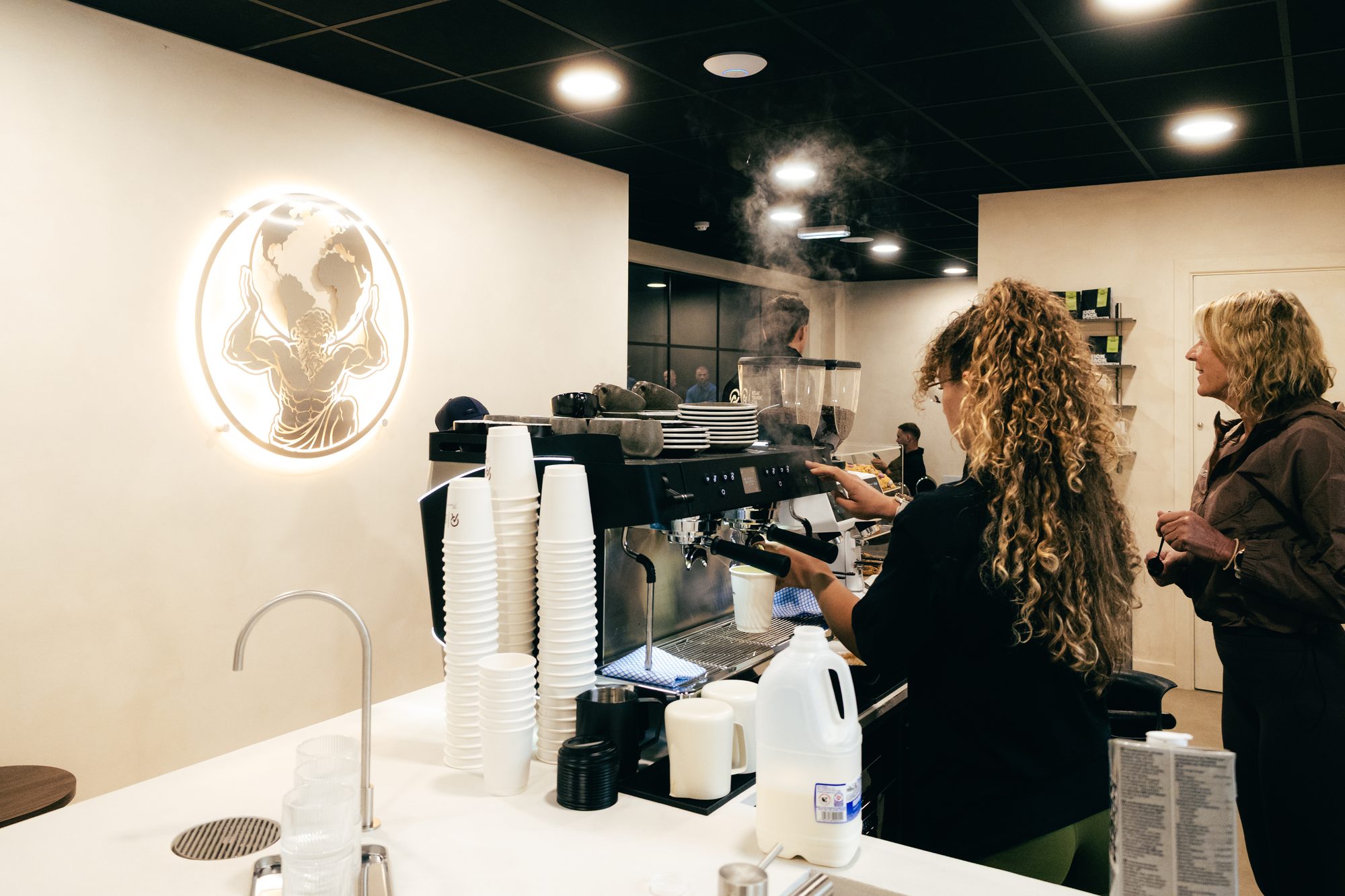 Barista making coffee in the social café at Atlas Training Club, Adlington
