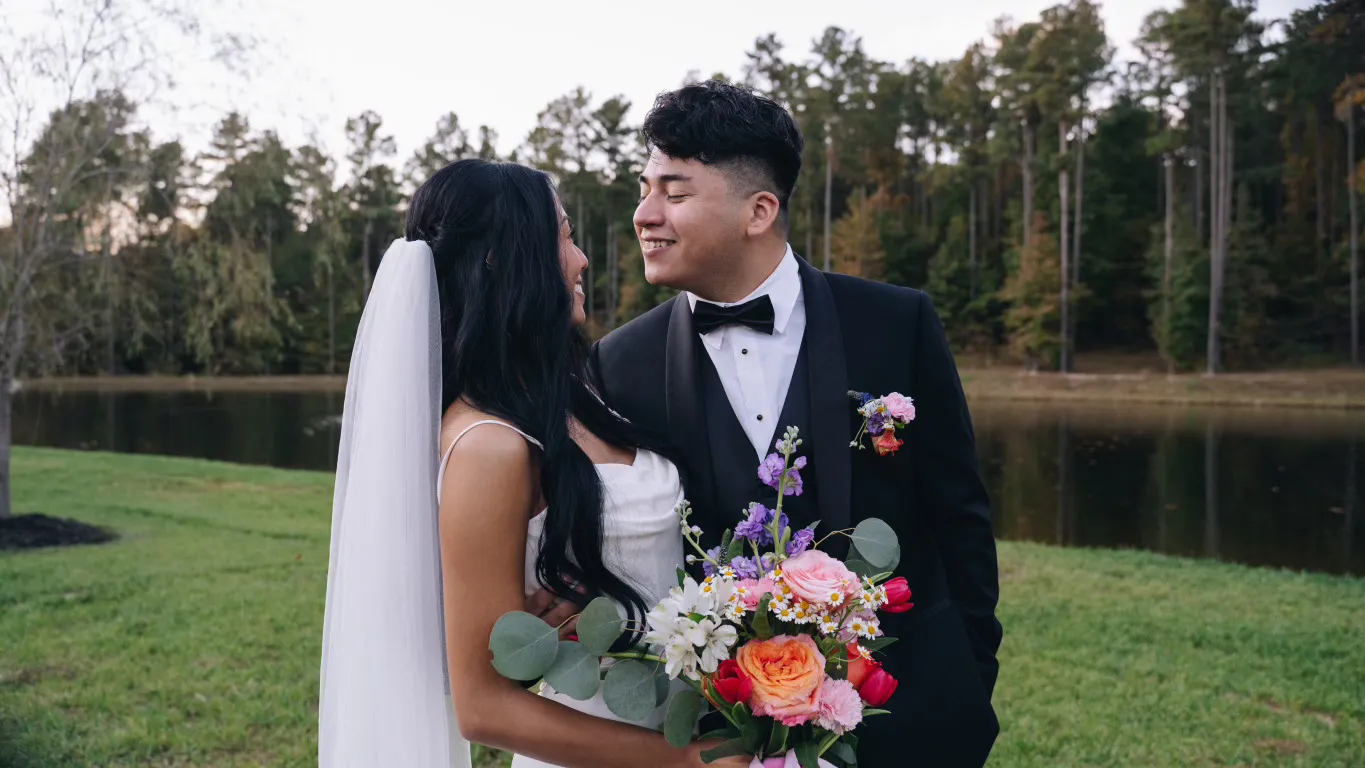 Bride with sleek straight hairstyle and cathedral veil at an outdoor lakeside wedding venue, styled by Dayln Faith Hair and Beauty