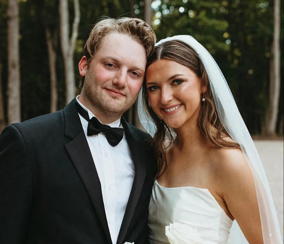 Bride with elegant half-up half-down hairstyle and veil styled by Dayln Faith Hair and Beauty in North Carolina