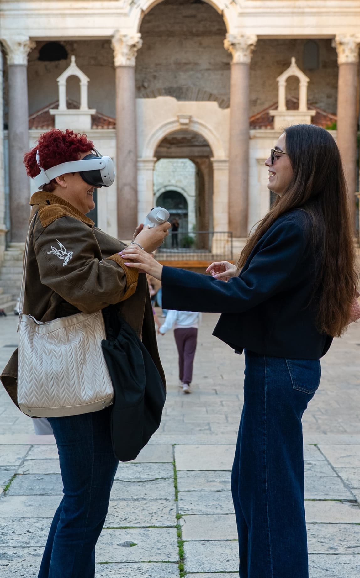 Tour guide helping guest with VR headset at Peristyle Diocletian's Palace Split