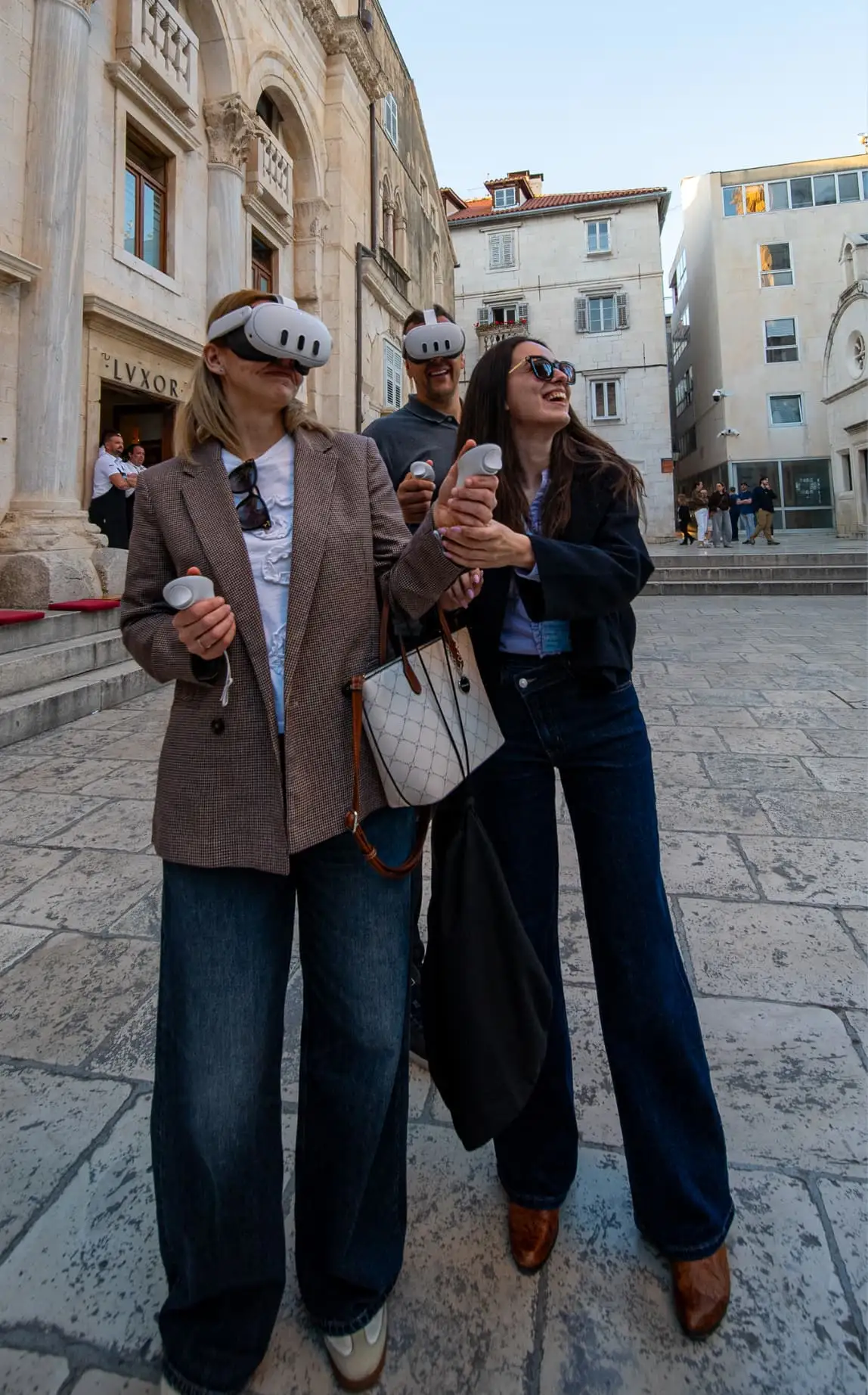 Tourists smiling while using VR headsets at Diocletian's Palace