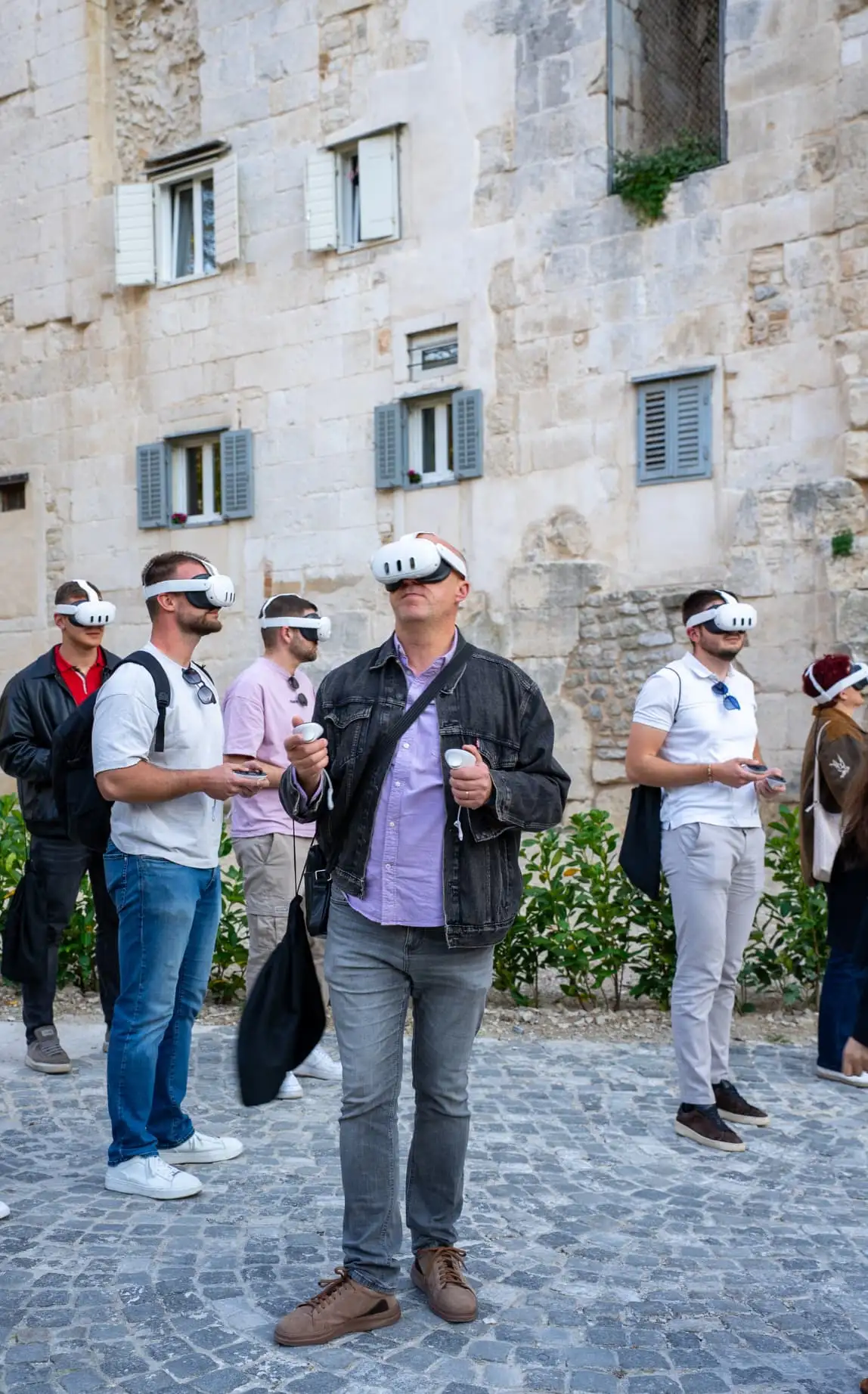 Group of tourists immersed in VR scene at Golden Gate