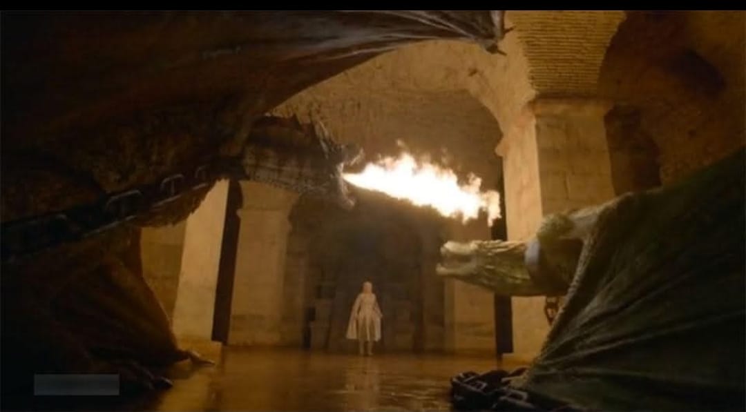 Daenerys approaching a chained dragon breathing fire in the dragon dungeon, Diocletian's Cellars