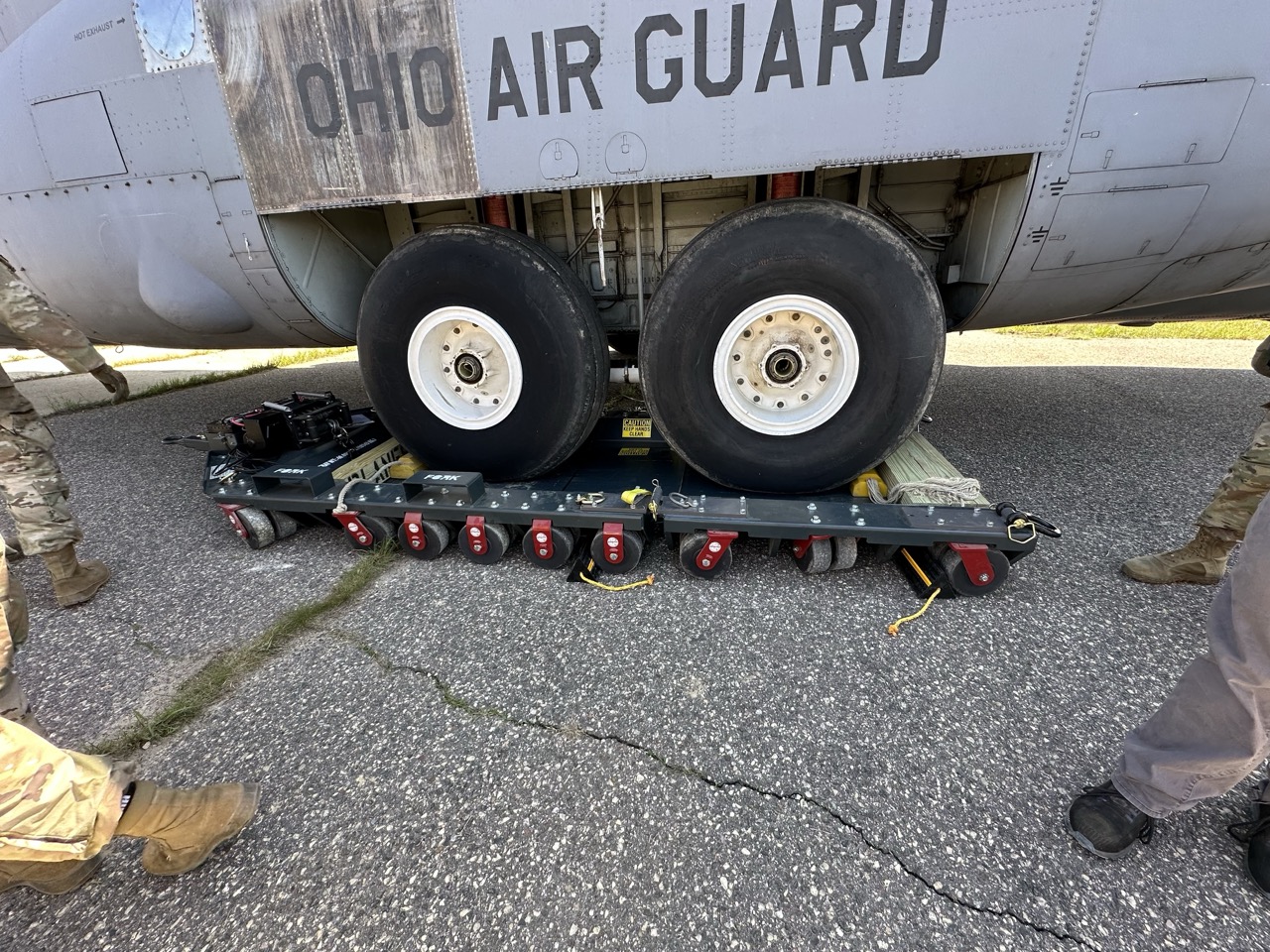 PlaneSkate 100K with C-130 Extension Kit deployed under a Lockheed C-130 military transport aircraft