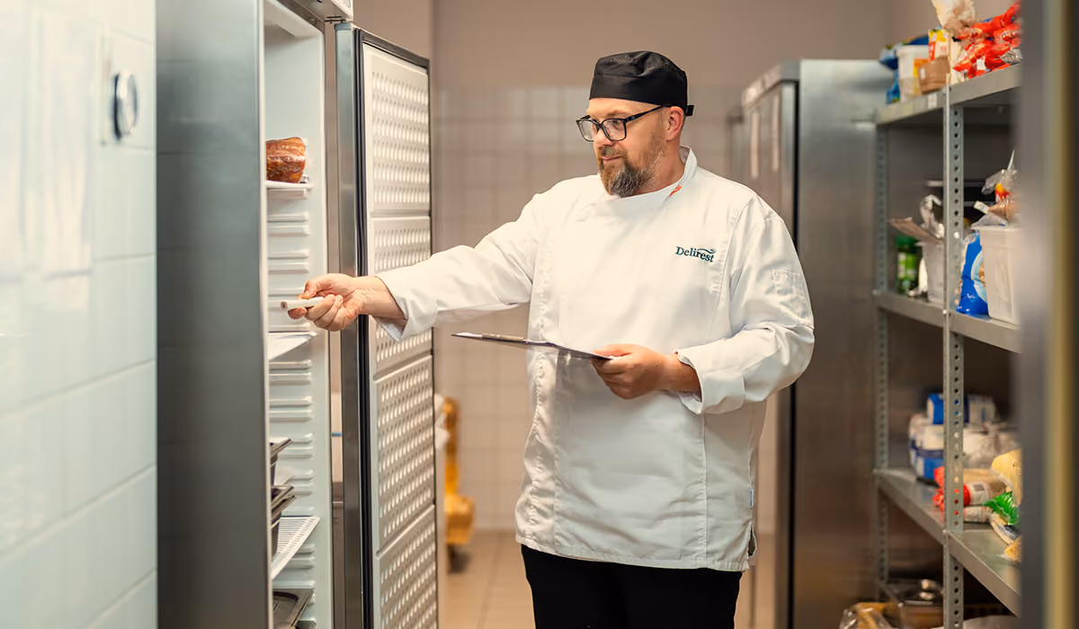 A hospital kitchen team working under strict hygiene protocols