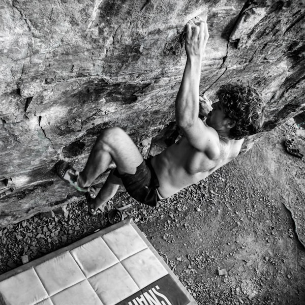 a person climbing a rock wall