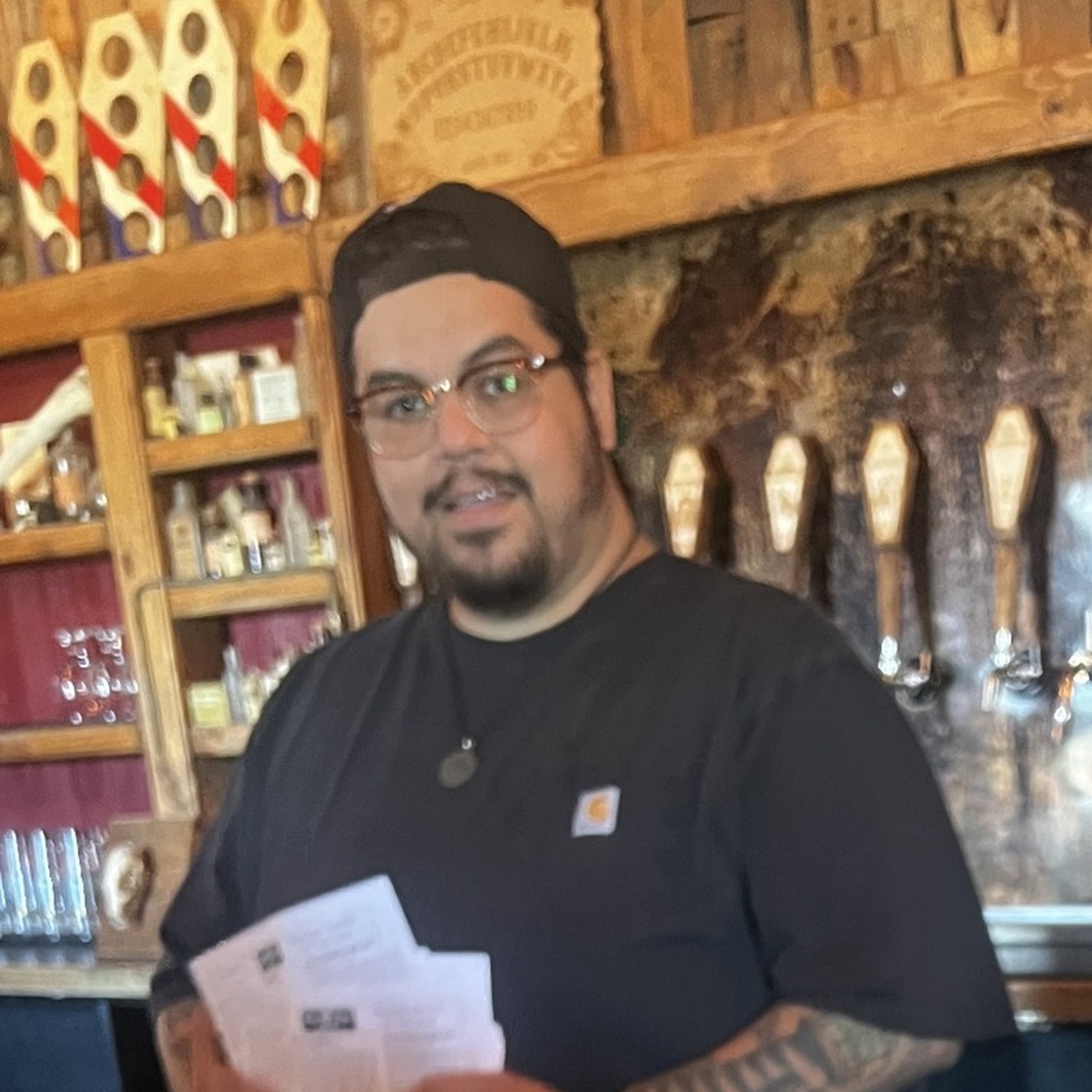 Noel Garcia behind the Bone Haus taproom bar