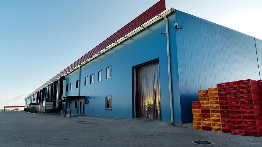 Modern GCC industrial warehouse exterior with loading bays