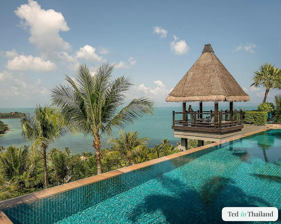 Thatched sala above the main infinity pool at Four Seasons Koh Samui, one of the best luxury resorts in Koh Samui