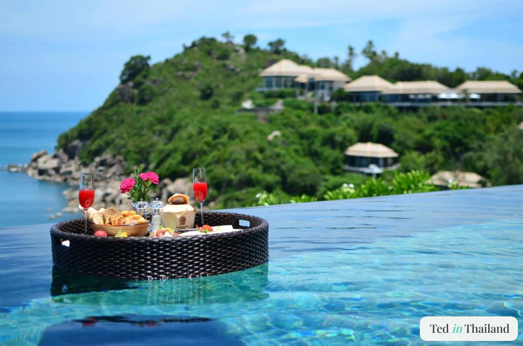 Floating breakfast tray in a private infinity pool villa at Banyan Tree Samui, a honeymoon resort on Koh Samui