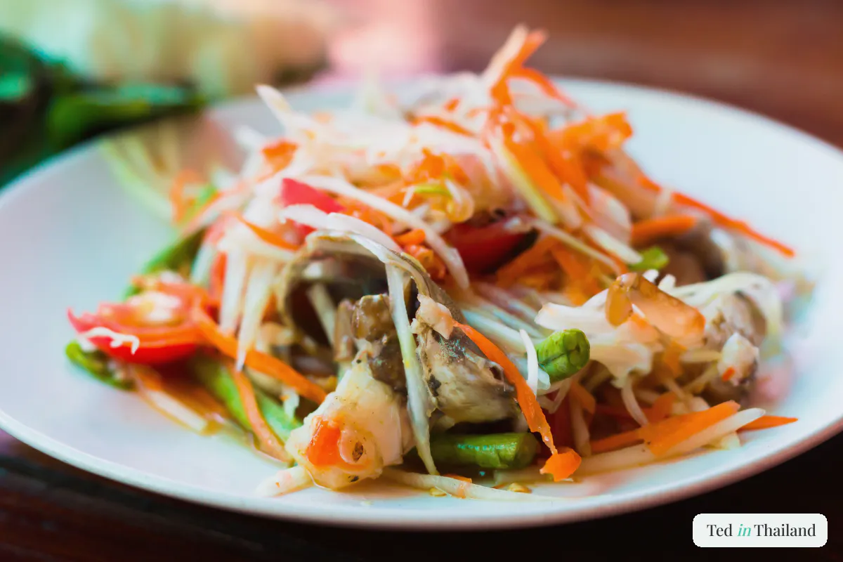 Spicy som tam green papaya salad, part of the Isan combo at Maenam's local restaurants