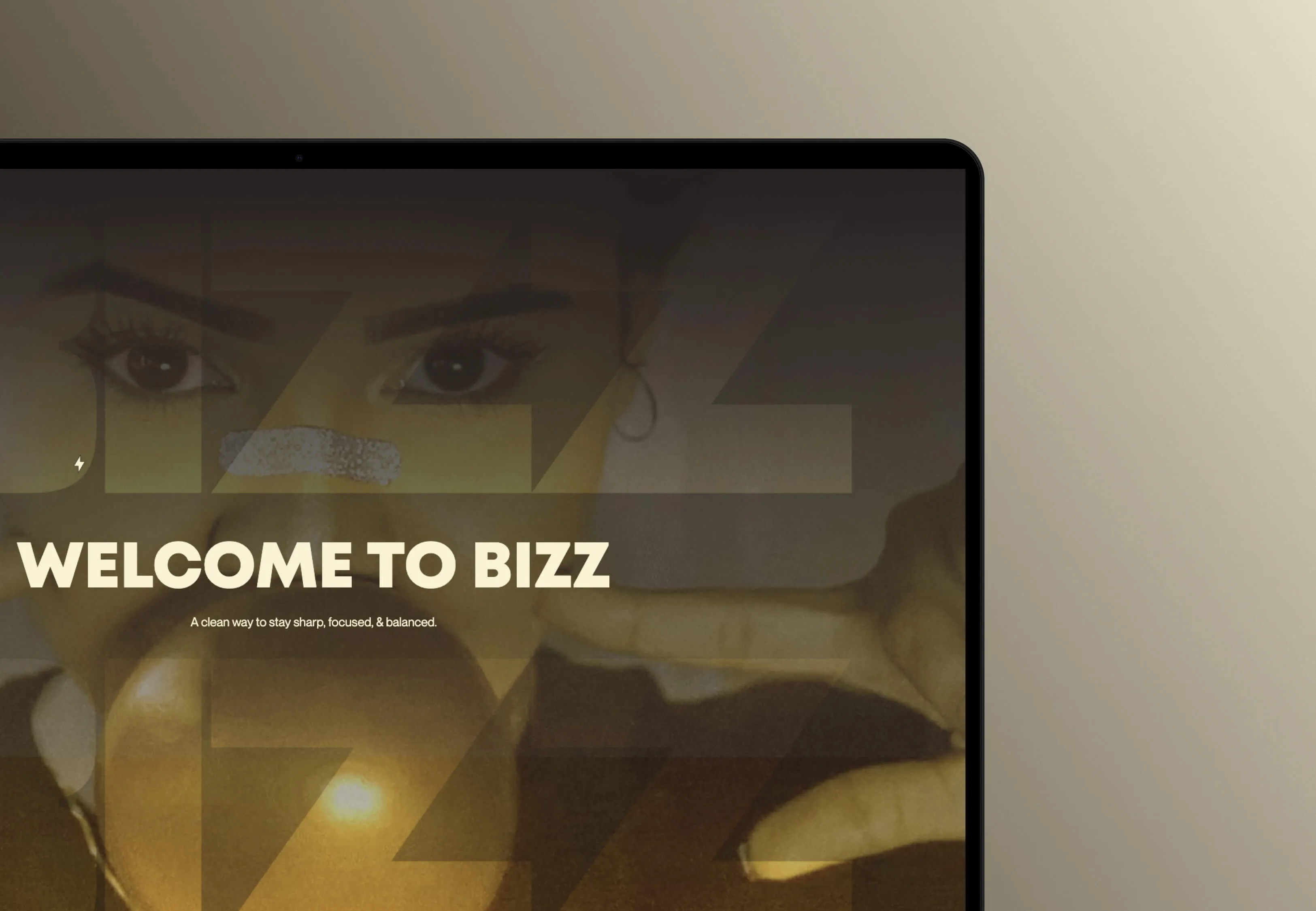Tablet screen shows a person with a silver nose strip and text 'WELCOME TO BIZZ' on a beige background.