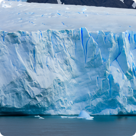Blue ice formations glowing with deep crystal‑blue color