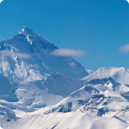 Chomolungma mountain peak covered in snow high above the Himalayas