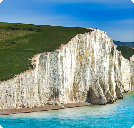 White Cliffs of Dover showing tall white chalk cliffs above the blue sea