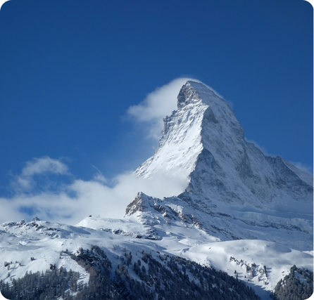 Matterhorn mountain with sharp triangular peak covered in snow