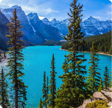 Moraine Lake in Banff with bright turquoise water surrounded by tall mountain peaks