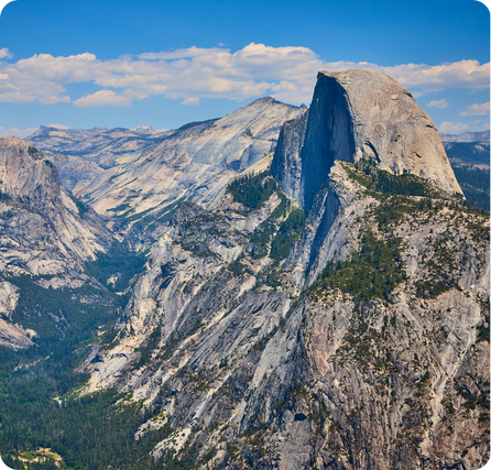 Yosemite Valley with towering granite cliffs and tall waterfalls