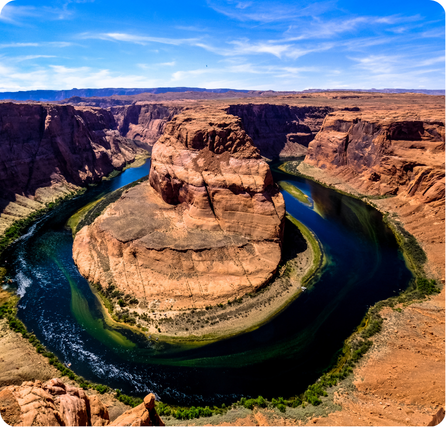 Horseshoe Bend with a curved river flowing around a red rock canyon