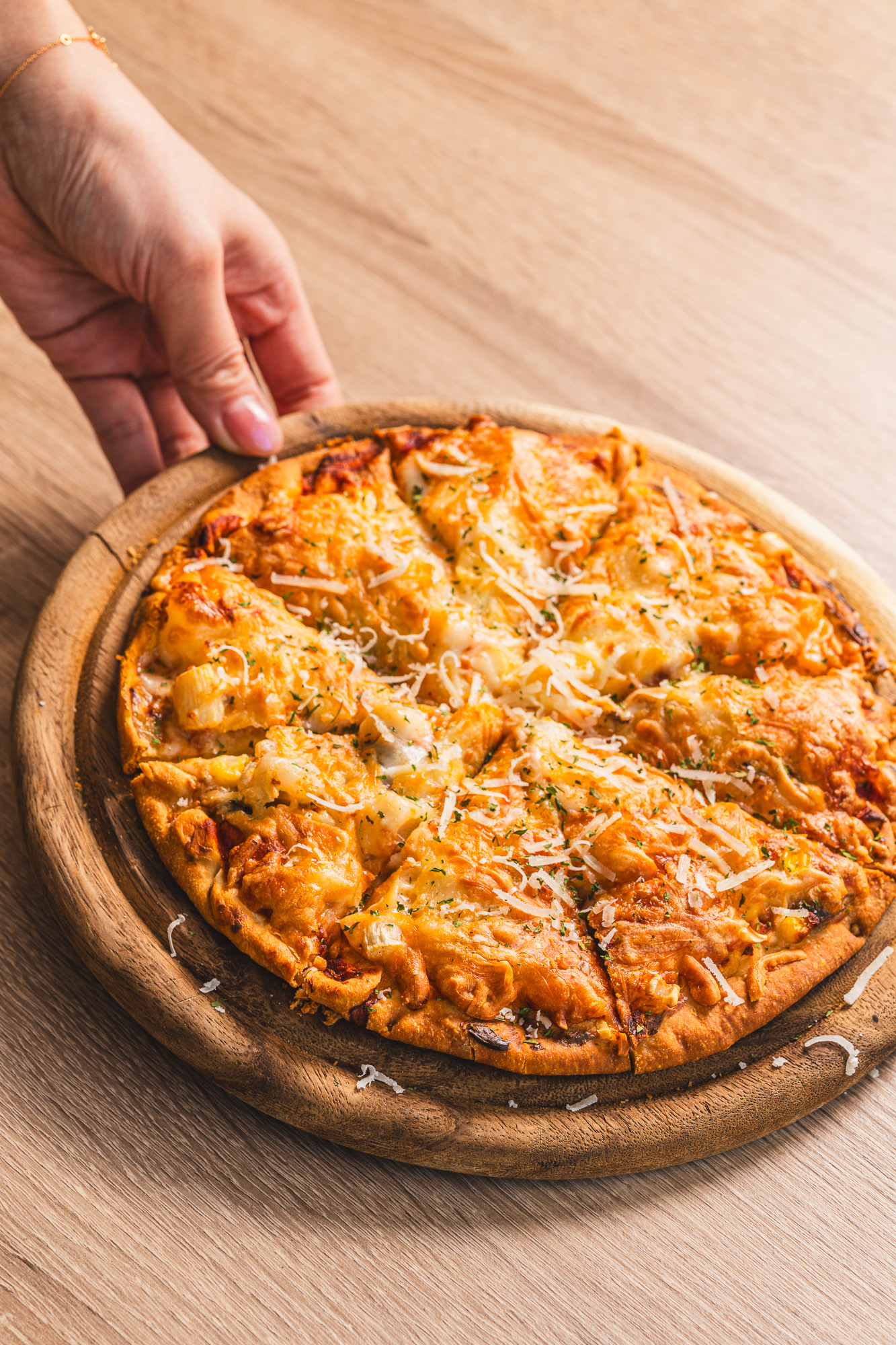 Seafood pizza on a wooden board at Karkumi Cafe in Scarborough.