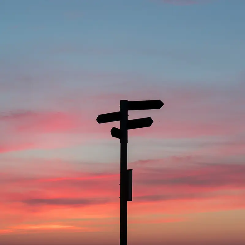 A crossroad signpost and sunset
