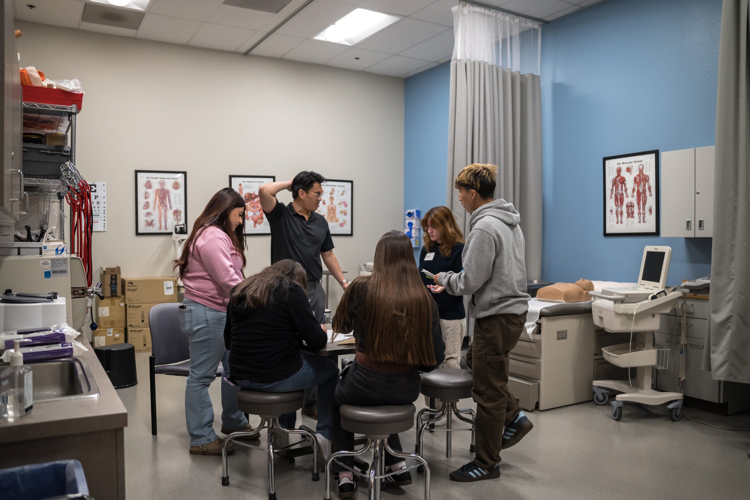 Students gathered in a clinical classroom during a hands-on healthcare career program.