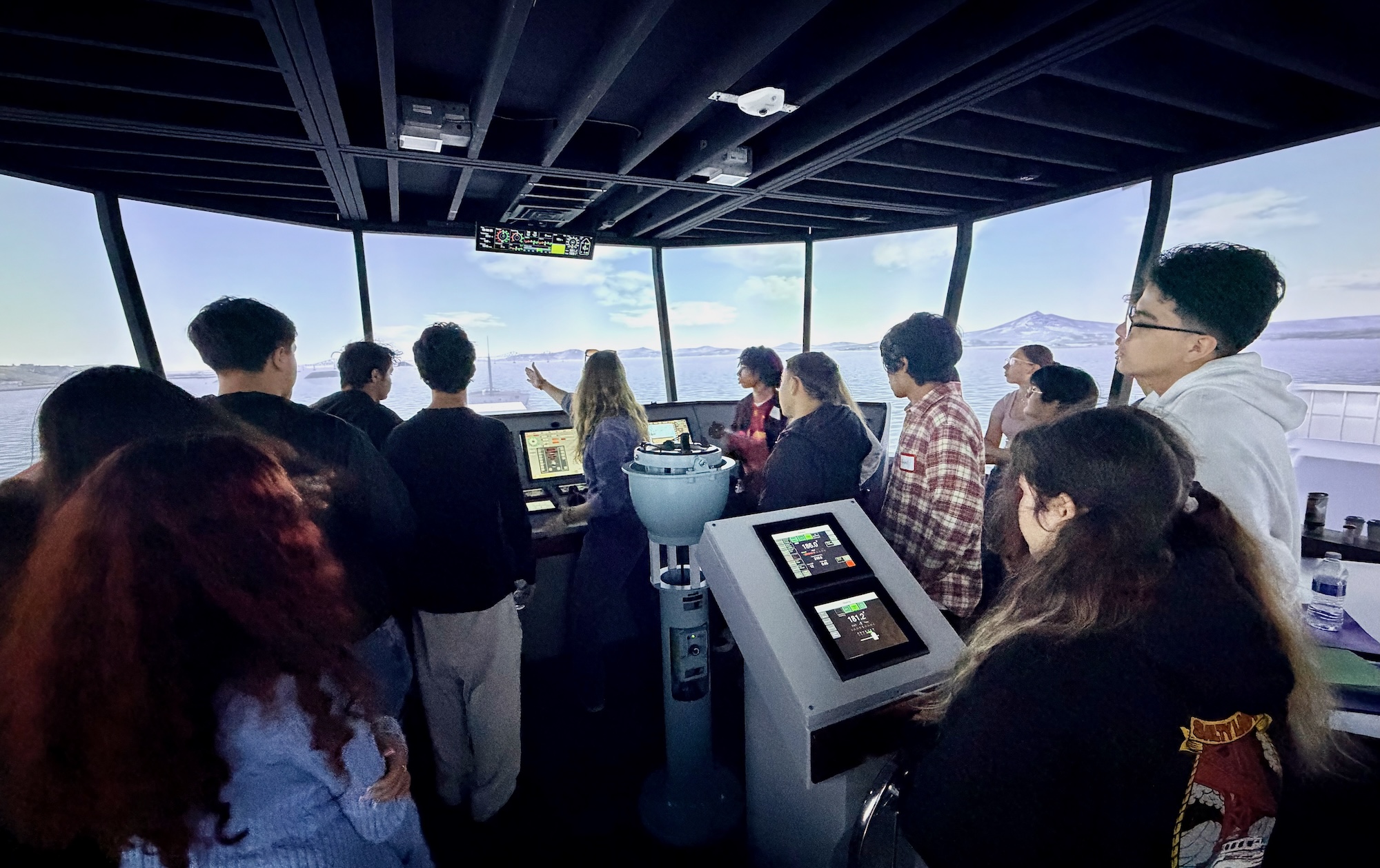 Container ship and tugboat moving through a harbor as part of a maritime career pathway image.