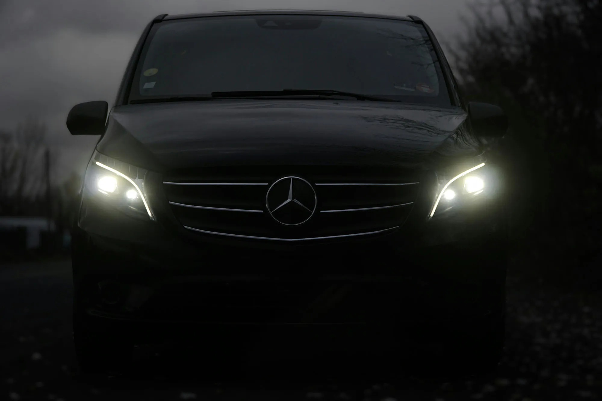 Mercedes-Benz private transfer vehicle at night