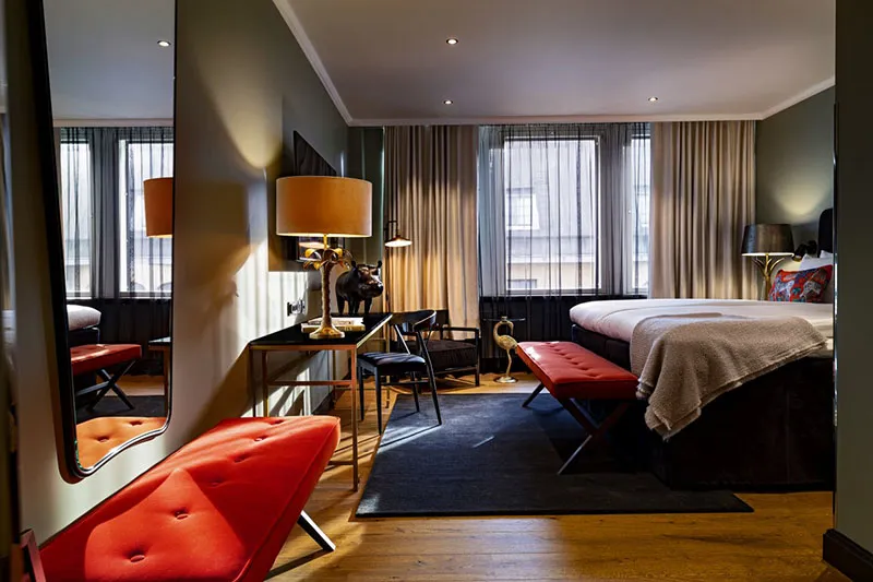 Modern premium hotel bedroom with city views