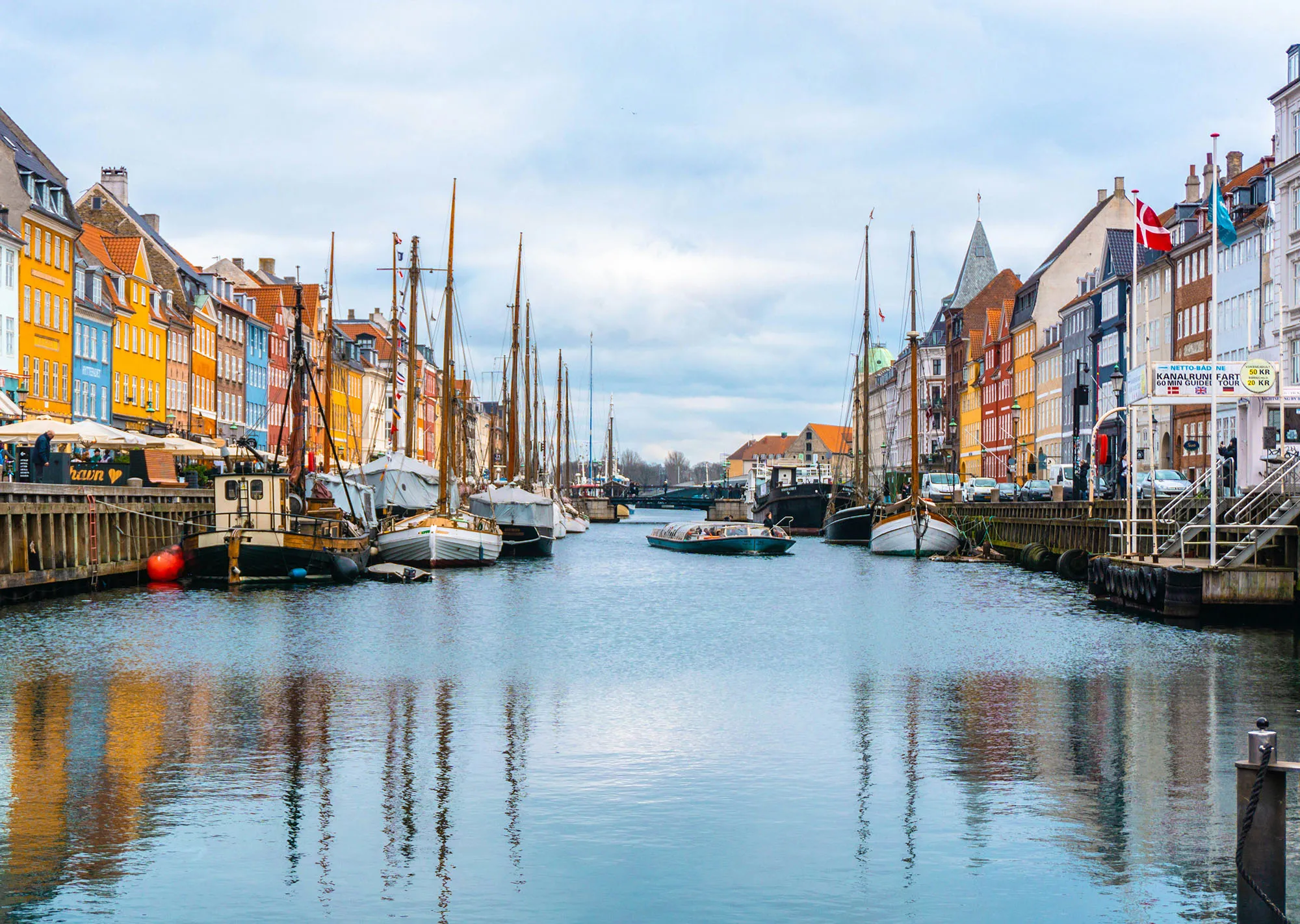 Colourful buildings and boats along Nyhavn in Copenhagen