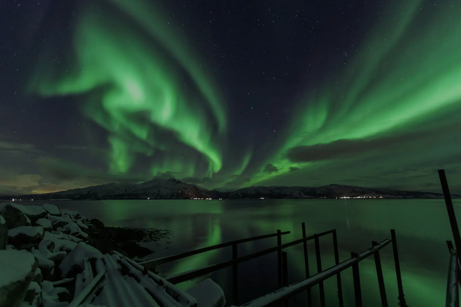Northern Lights above a snowy Arctic landscape