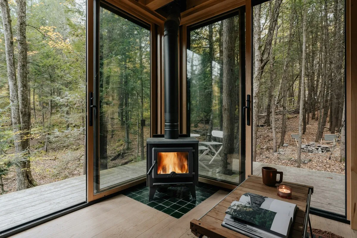 Glass-fronted cabin overlooking a Finnish forest