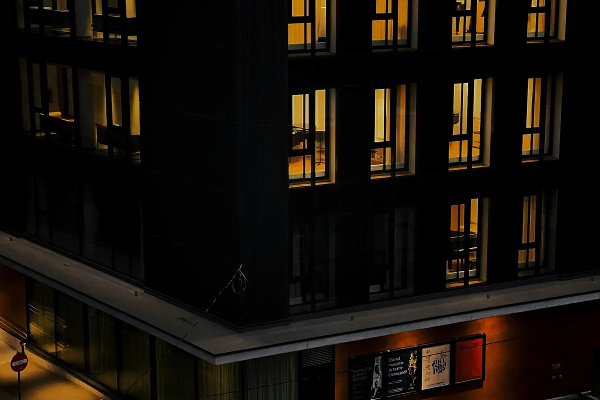 Modern building with lit windows at dusk