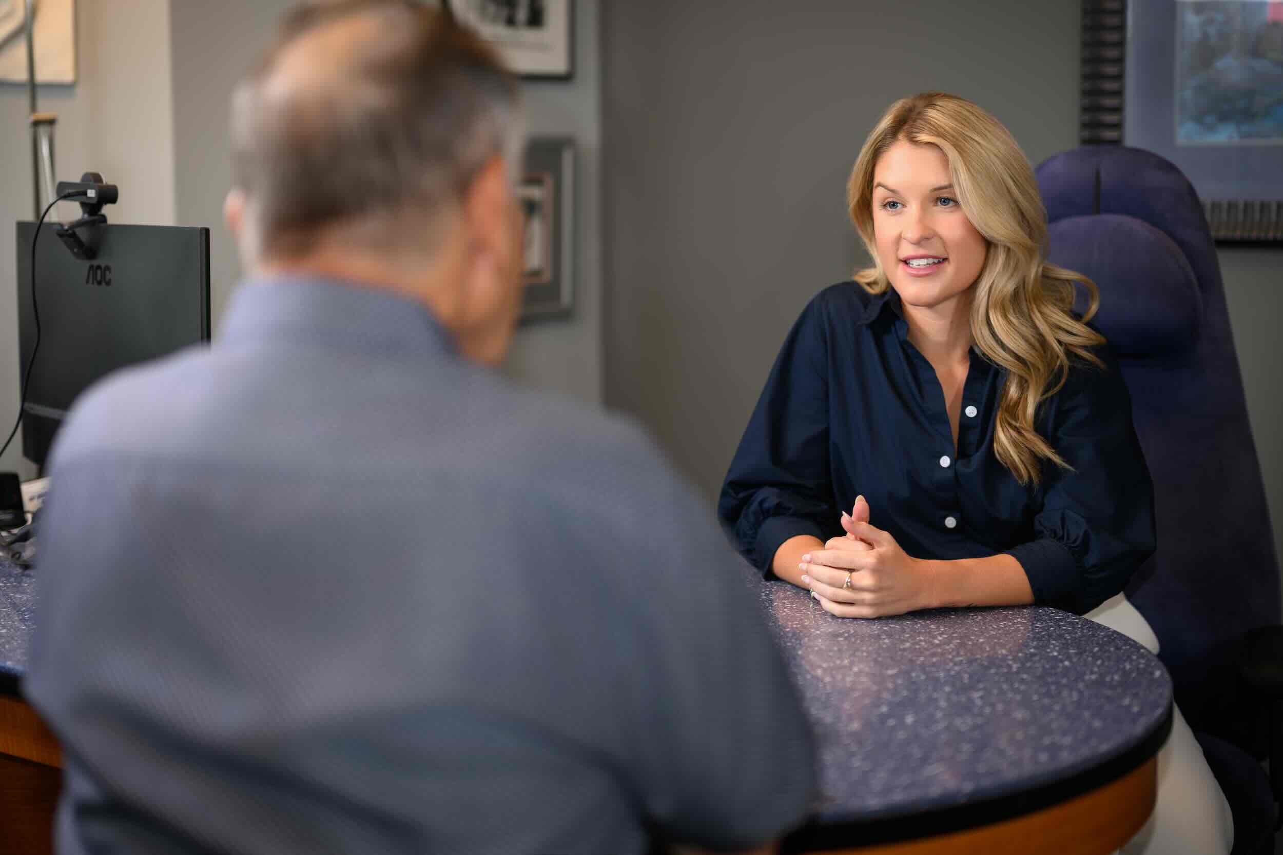Dr. Paige Wendling, AuD, meeting with a patient