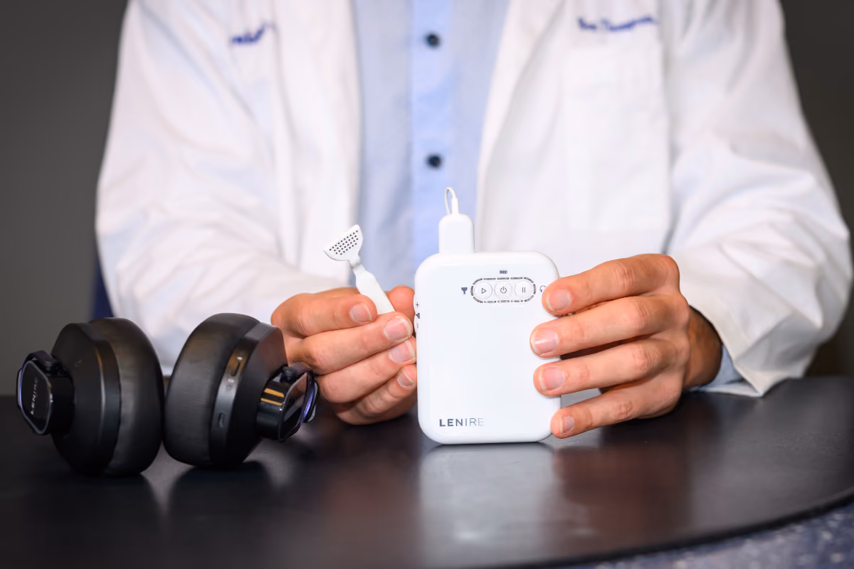 The Lenire device: headphones and handheld controller