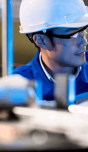 Engineers inspecting equipment on a production line