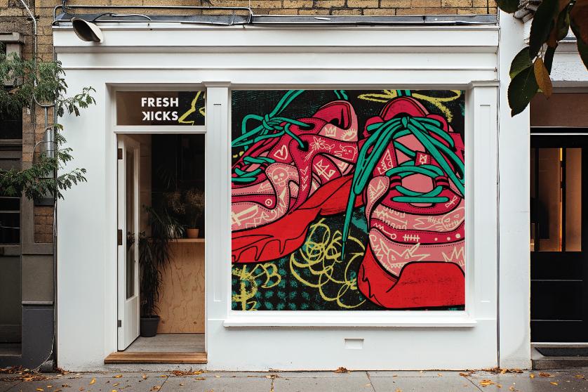 Storefront with a colorful mural of red sneakers with green laces and graffiti-style designs.
