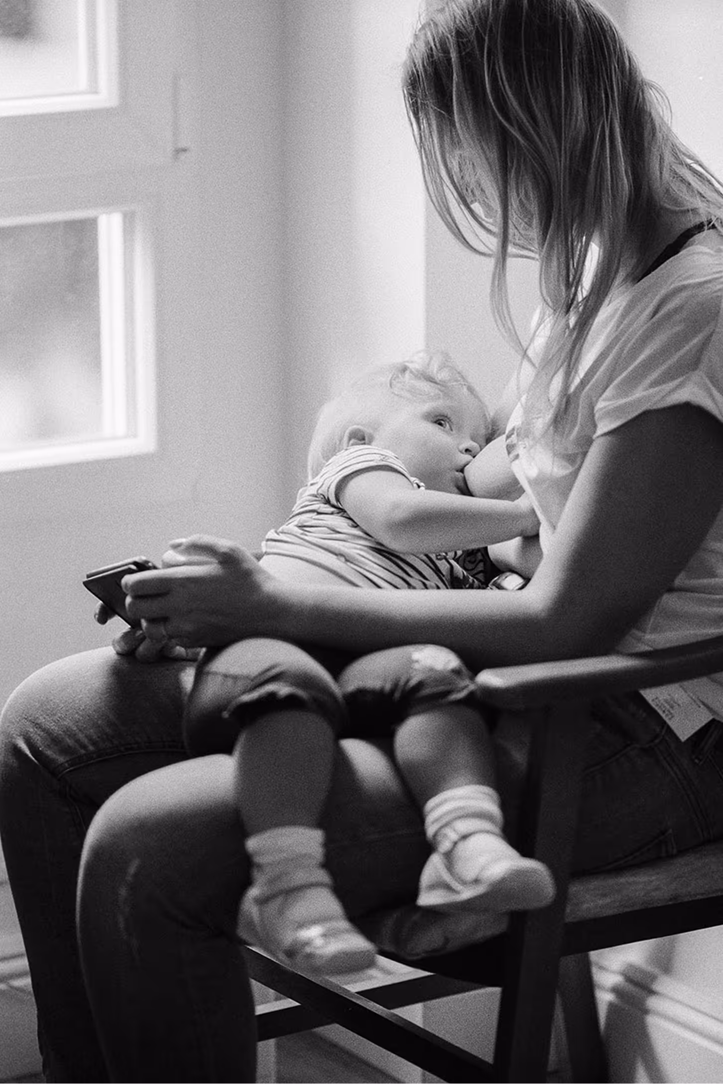 a woman breastfeeding a baby