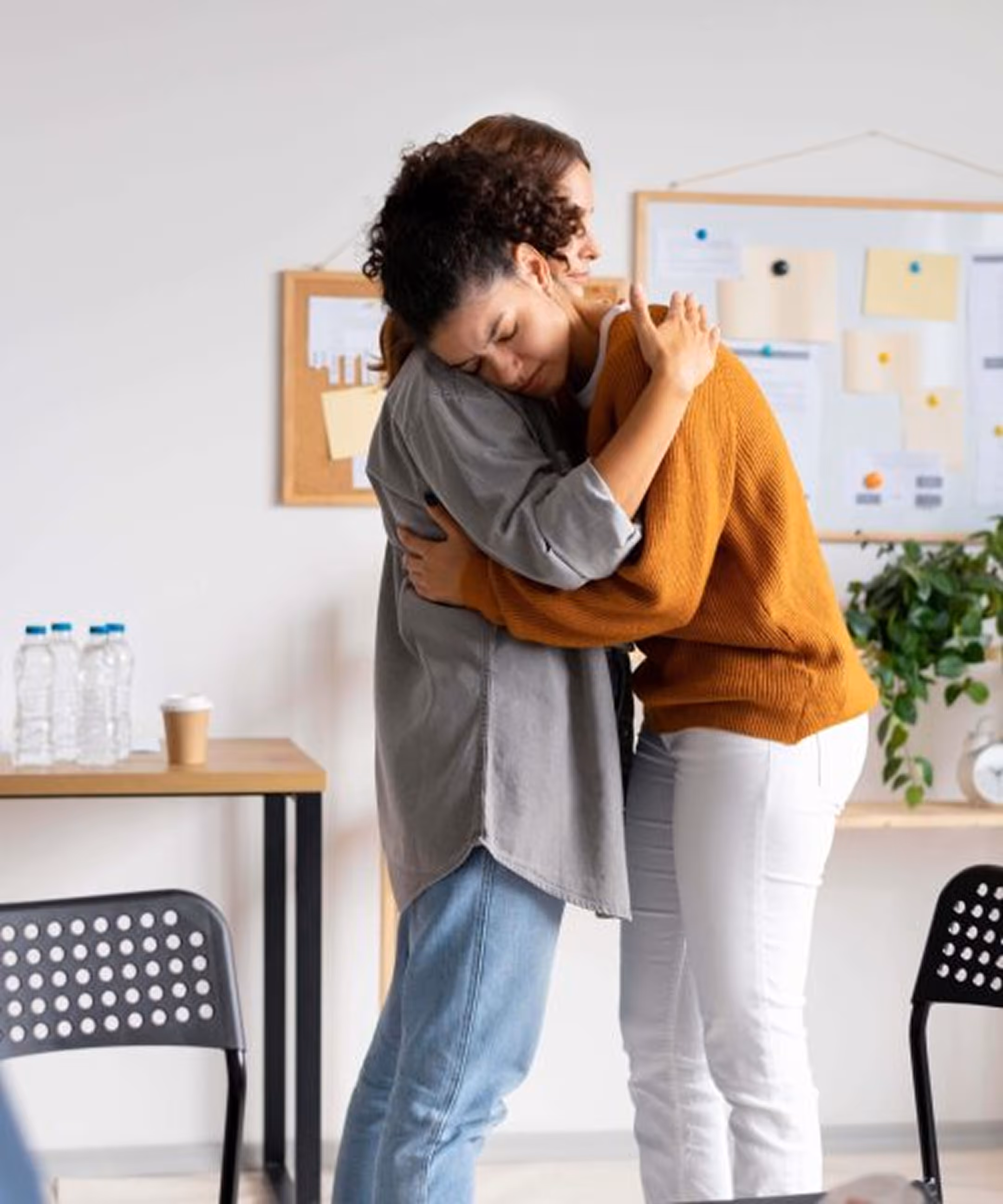 two women hugging and comforting each other
