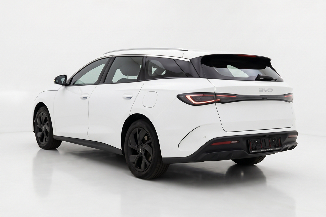 White BYD electric station wagon shown from rear left angle on white background.
