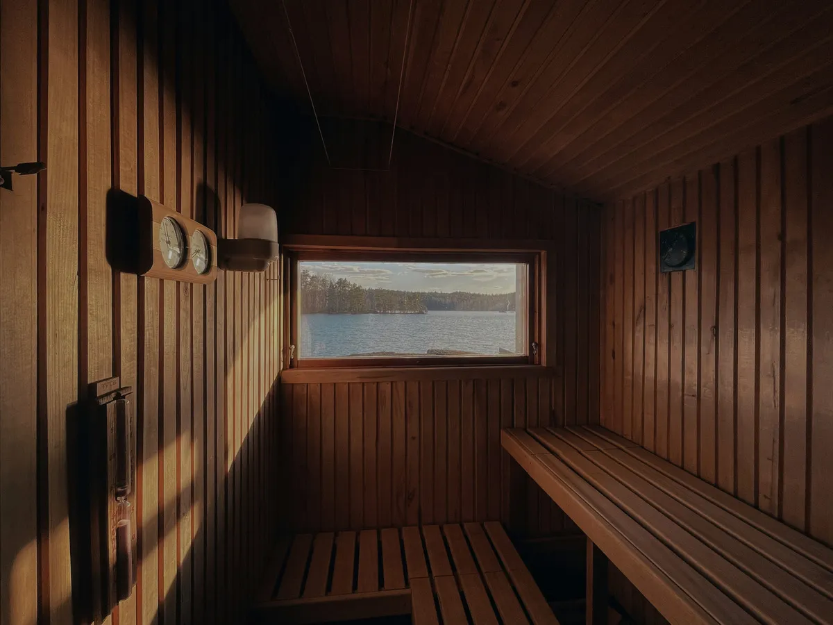 Warm sauna cabin in the forest during a private Finnish wellness evening