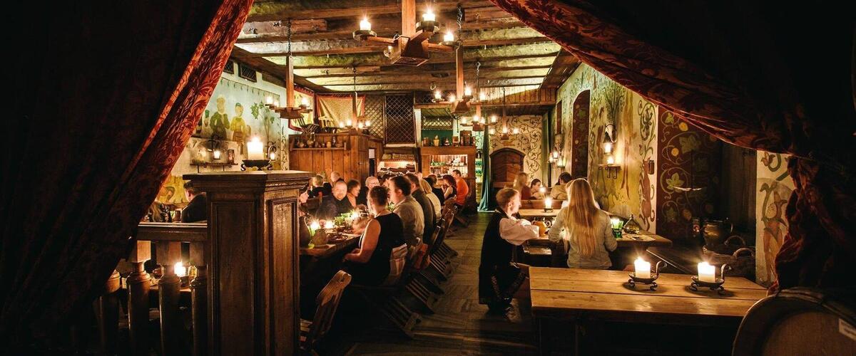 Candlelit historic restaurant dining room in Tallinn Old Town