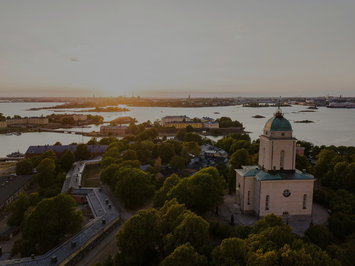 Aerial view of Suomenlinna Church and the fortress islands at sunset