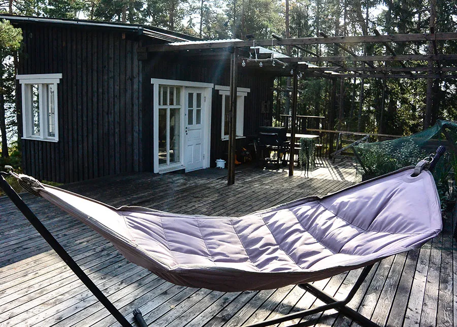 Outdoor hammock on a private summer cottage island in the Helsinki archipelago