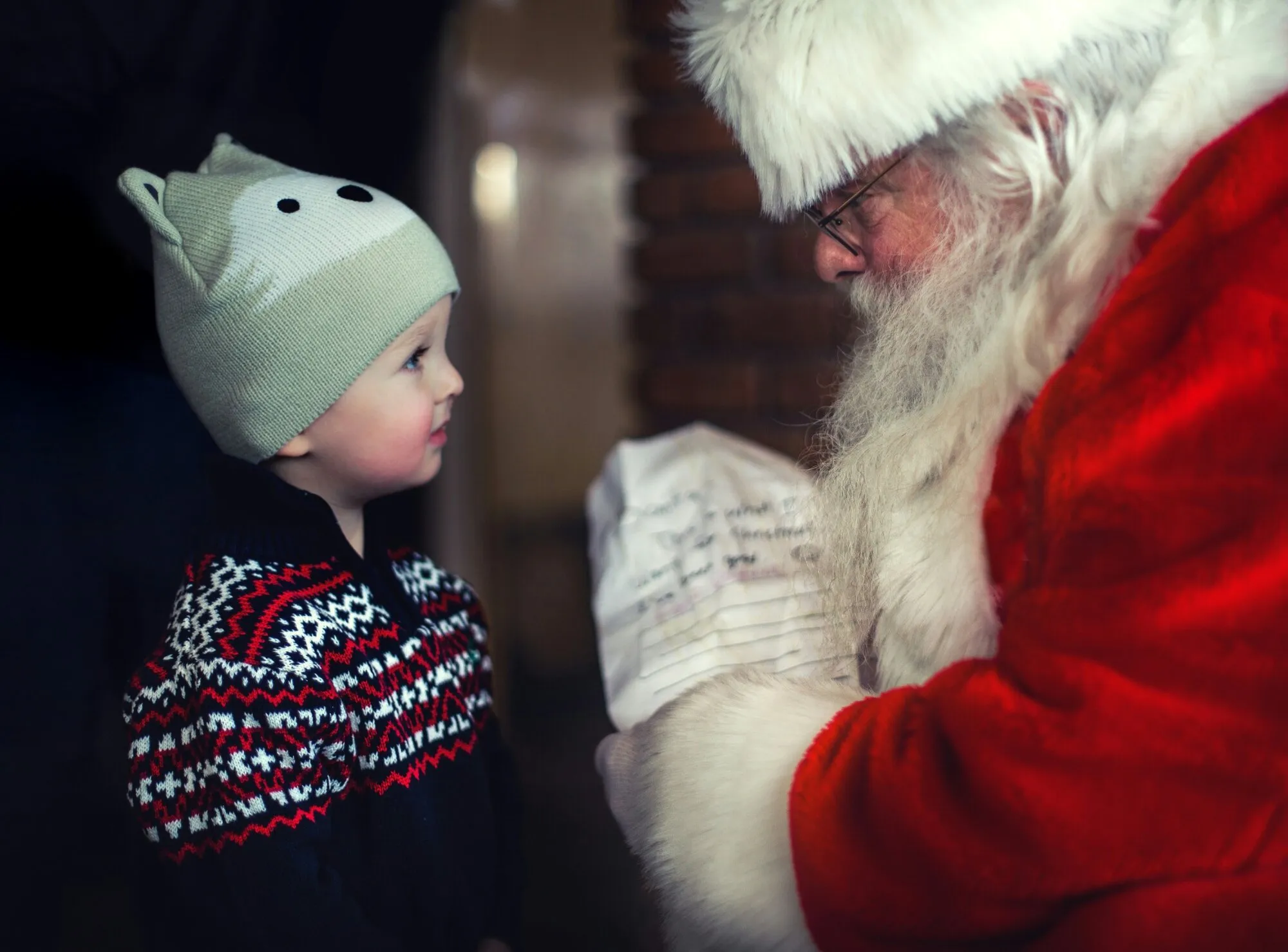 Young child meeting Santa Claus